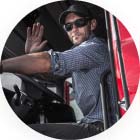 image of man in truck waving